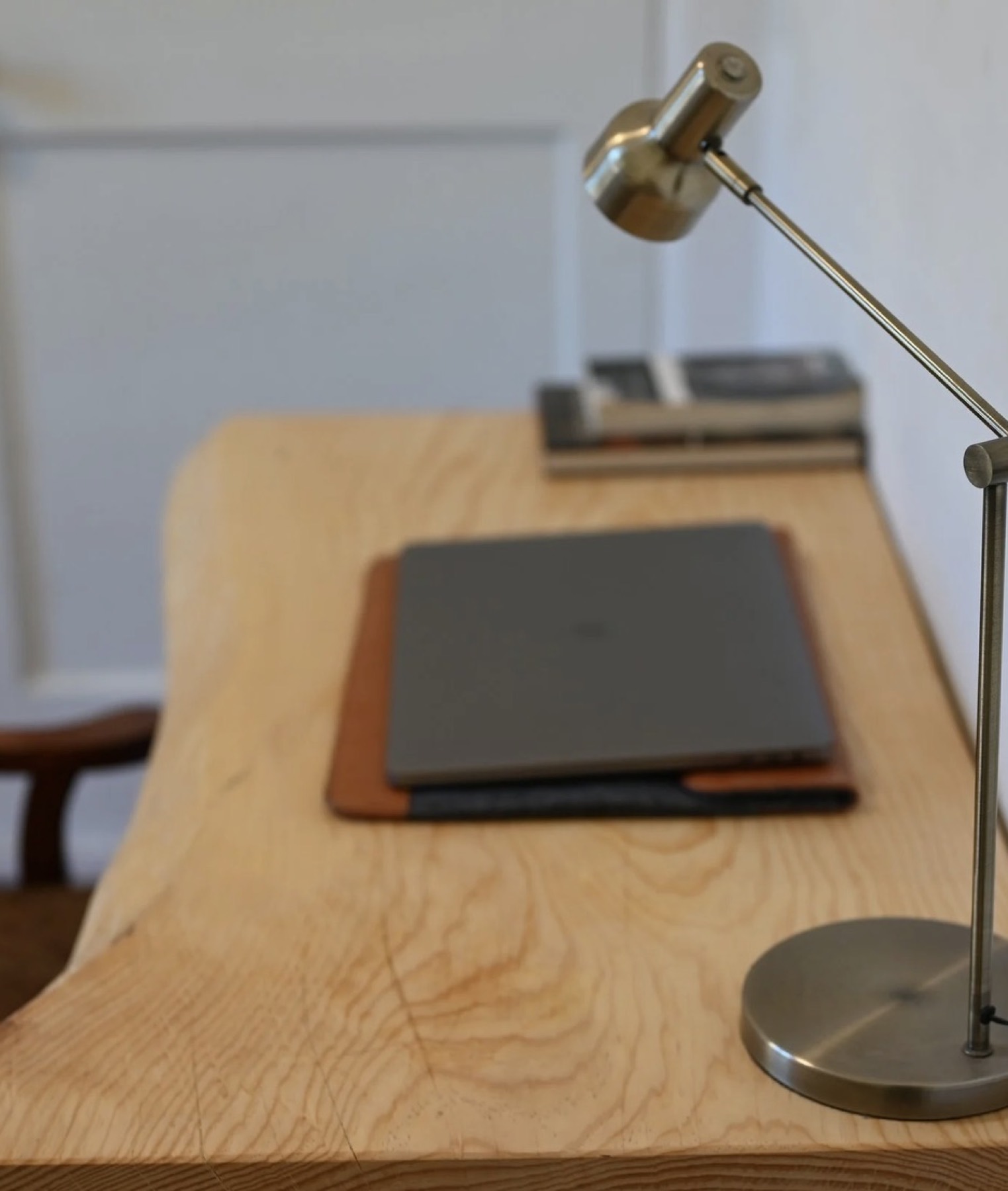 Top view of the Aleppo Pine Desk with a lamp and laptop