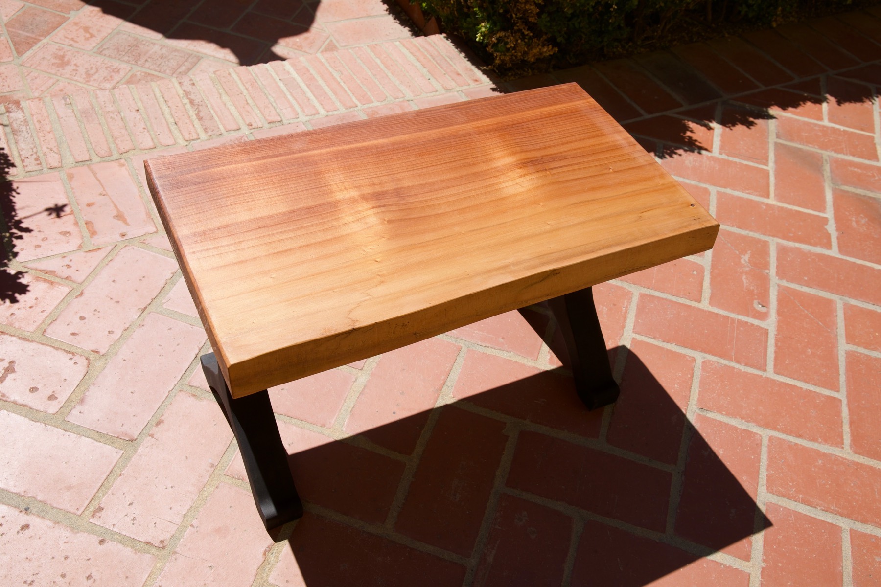 Redwood Coffee Table angled view with dark legs